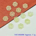 Close-up view of 14mm translucent lampwork sunflower beads for DIY jewelry crafts. - Light Green