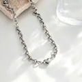 Elegante zilveren roestvrijstalen grove schakelketting met een minimalistische hartje - Ketting / Staalkleur