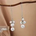 Elegant silver-toned drop earrings with clustered white pearls for a sophisticated look. - E2079-3