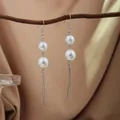 Elegant long drop earrings featuring white pearls and silver tassels hanging on a branch - E2079-7
