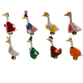 Detailed view of eight unique seasonal holiday outfits for 23-inch decorative porch geese - 8-Piece Goose Outfit Sets