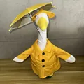 Porch goose in yellow raincoat with matching hat and miniature umbrella detail view - Raincoat Button Style
