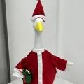 Detailed view of a 23-inch porch goose in a red Santa Claus outfit with a gift bag - Christmas Style B