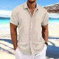 Macro view of men's beige cotton linen shirt featuring unique vertical jacquard texture. - Apricot