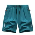 Herren Schnelltrocknende Sportshorts in Blaugrün mit Kordelzug und Reflektoren - S / Unterteile / Seeblau