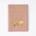 Durable pink PVC passport cover featuring elegant gold world map and airplane design - Passport Cover Pink