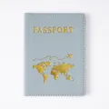 Elegant light blue PVC passport cover featuring golden world map and airplane design - Light Blue Passport Covers