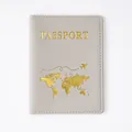 Premium grey PVC passport cover holder featuring a gold embossed world map design - Grey Passport Covers