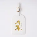 White faux leather luggage tag featuring a detailed gold foil world map and airplane - Luggage Tag White