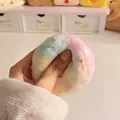 Detailed view of a hand squeezing a colorful handmade crunchy texture stress-relief ball toy - Rainbow Crispy Style / 1 Piece