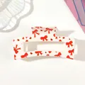 Detailed close-up view of a white hair claw clip with red bow and heart patterns - Style A White / 8.5cm Size