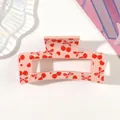 Close-up detail of a pink hair claw clip featuring a cute red cherry and bow tie print pattern - Type D Pink / 8.5cm Size
