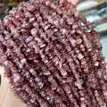 Macro detail showing the texture of natural red strawberry quartz holed gravel chips - Grade A / 5-8mm (80cm) / Red-Pink