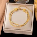 Pulsera multicapa de acero de titanio dorado con detalles de circonitas brillantes. - Cadena de Espiga de Triple Capa (E2543) / Dorado