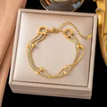 Elegante pulsera cruzada de múltiples hilos de acero de titanio dorado con eslabones en D - Cadena de Serpiente de Triple Capa con Cuentas (E2542) / Dorado