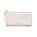 Close-up detail of a cream minimalist long wallet with a functional wristlet strap - Simple Style / Beige