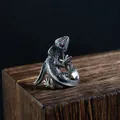 Detailed view of a vintage silver lizard ring with red eye on wood texture - Lizard Shape Open Ring (A373)