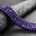 Close-up of faceted purple 4x6mm abacus beads for elegant DIY jewelry making and crafts - 4x6mm Faceted (Approx 82 Pieces) / Purple Crystal