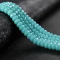 Detailed macro shot of faceted 4x6mm turquoise blue rondelle beads for jewelry DIY - 4x6mm Faceted (Approx 82 Pieces) / Medium Amazonite Color