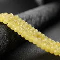 Macro view of light yellow 4x6mm faceted abacus wheel beads for DIY jewelry crafts - 4x6mm Faceted (Approx 82 Pieces) / Medium Yellow Jade