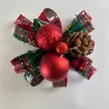 Close-up of Christmas decorative bow with plaid ribbon red balls and natural pine cone - Red And Green Plaid Bowknot Style / Red