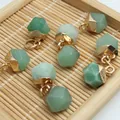 Macro detail of green faceted gemstone pendants with gold caps on a natural bamboo mat - 8x13mm / Aventurine Style (1)