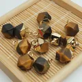 Close-up view of faceted natural tiger eye stone charms with gold-plated caps for DIY jewelry - 8x13mm / Tiger Eye Style (6)