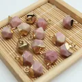 Detailed macro view of faceted pink crystal pendants with gold caps for DIY jewelry - 8x13mm / Pink Agate Style (4)