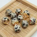 Detailed macro view of faceted Dalmatian jasper stone pendants with gold plated caps - 8x13mm / Dalmatian Jasper Style (17)