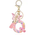 Pink resin letter Q keychain with heart sequins, butterfly charm and tassel - Letter Q