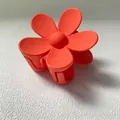 Gros plan détaillé d'une pince à cheveux fleur orange mate pour chignons élégants - 7.5CM (Vrac) / Orange