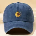 Stylish washed navy blue baseball cap featuring a vibrant sunflower print design - M (56-58cm) / Navy Blue