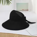Elegante sombrero de sol negro para mujer con lazo grande y diseño de ala ancha plegable. - Negro
