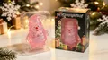 Jouet squishy Père Noël rose à paillettes dans sa boîte cadeau de Noël festive. - Père Noël / Père Noël Rose à Paillettes