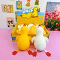 Close-up of two large 33cm slow rebound duck squeeze toys in yellow and white colors - Jumbo Duck Squishy / 33cm (Pack of 8)