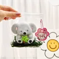 Koala themed decompression squishy toy in clear blind bag packaging with green moss - Plant Koala Squishy Toy / Squishy Toy With Small Gift