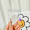 Animal-shaped squishy charm with pearls and purple bell for backpack decoration - Croissant Shape Squishy Pendant With Bell