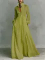 Vista dettagliata del maxi abito a pieghe verde chartreuse con maniche lunghe - Verde matcha