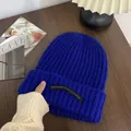 Royal blue ribbed knitted beanie for winter warmth featuring a stylish black woven label - One Size / Long Tag Style / Sapphire Blue