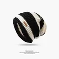 Black and white striped knitted slouchy beanie with Hand Made leather tag detail - One Size / Striped / Black and White