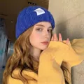 Stylish royal blue knitted beanie for winter warmth and comfort shown on a model - One Size / Twisted Chain / Blue