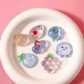 Cute fruit shaped translucent stress relief squeeze toys displayed on a white plate - Fruit Squishies