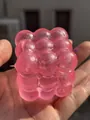 Detailed close-up view of a pink translucent cube maltose squishy stress relief toy - Rubik's Cube Style / 5cm / Pink