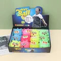 Palline puffer colorate assortite con faccine sorridenti in una scatola per alleviare stress - Palla con aculei polpo antistress