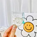 Cute transparent donut squishy keychain with white pearls and teal bell accessory - Donut Shape Squishy Pendant With Bell