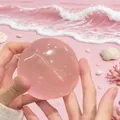 Translucent pink maltose squishy toy stress relief ball held in hands beach scene - Round Shape / 6cm (PVC Bag) / Pink