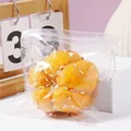 Realistic pumpkin bread squishy toy with colorful sprinkles and star decorations in a clear bag - Orange Pumpkin Bread Squishy