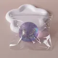 Pallina antistress viola con brillantini in sacchetto trasparente per relax sensoriale - 6cm / Squishy al maltosio aurora (viola)