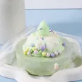 Soft silicone cream puff cake squishy toy with strawberry topper for stress relief. - Strawberry Puff Cake / Green