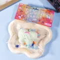 Lindo juguete squishy con forma de pastel de mariposa en un paquete colorido de píxeles - Verde